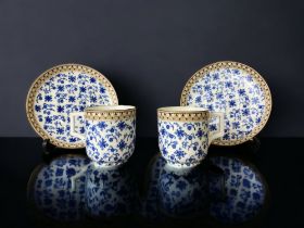 A PAIR OF VICTORIAN BROWNFIELD DRESSER STYLE DESIGN TEACUPS & SAUCERS.