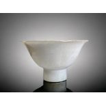 A lobed Chinese fine porcelain Tianbai stem cup. Ming Dynasty. Transparent white glaze. Height - 6.