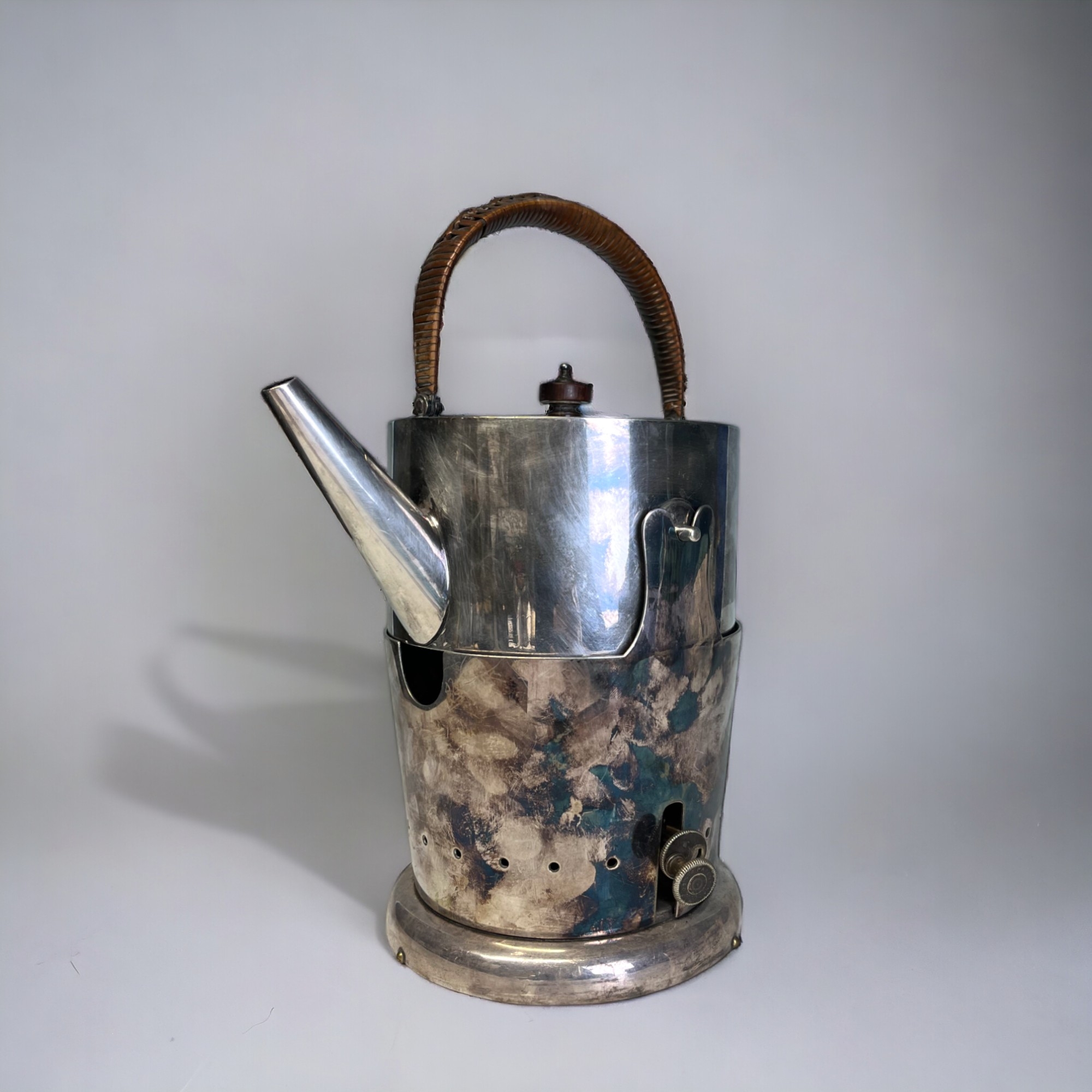 A VICTORIAN ELECTROPLATE KETTLE WITH WARMER. By Stephenson & son. Christopher Dresser style