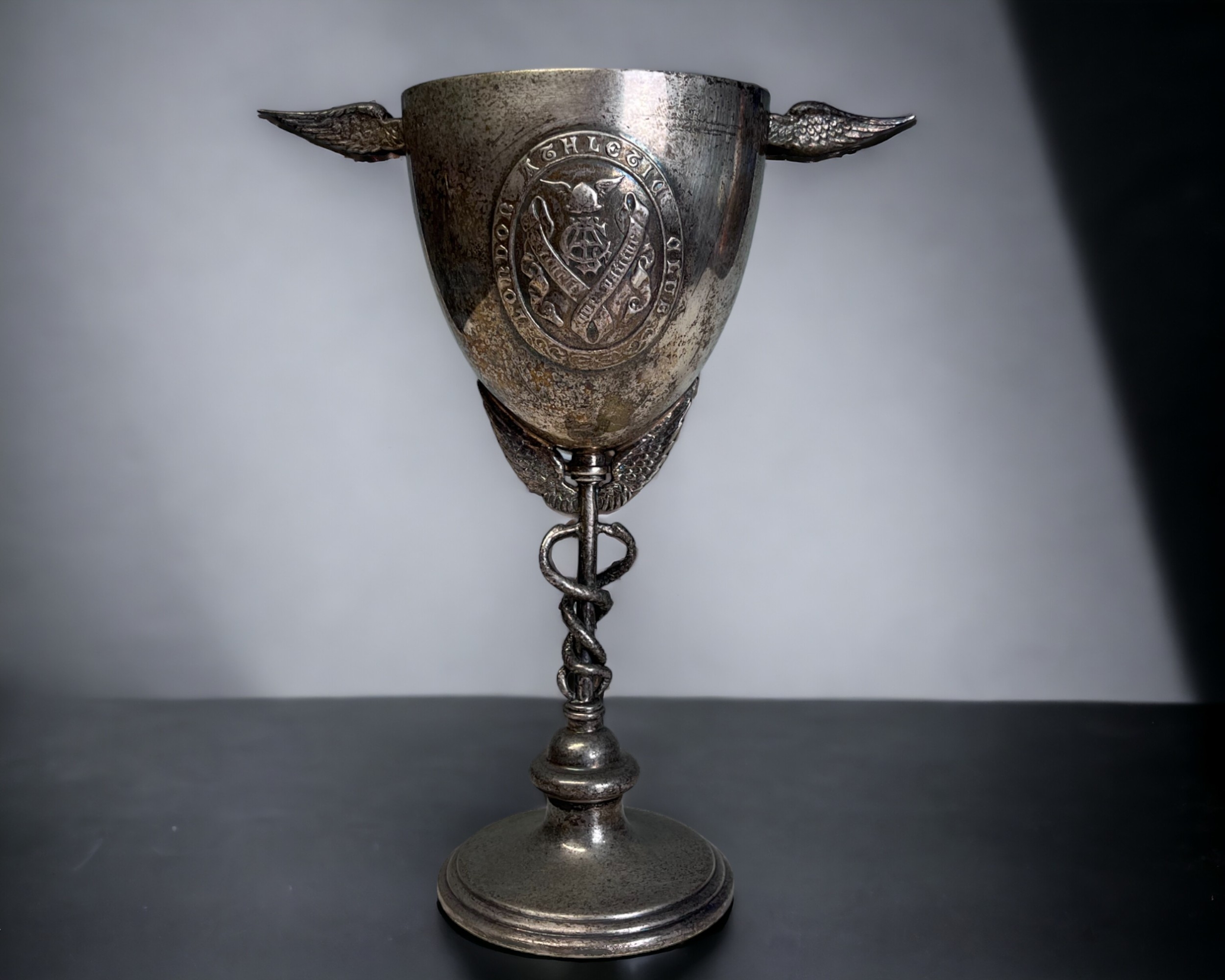 A VICTORIAN SILVER PLATE GOBLET / TROPHY. By Richard Hodd & son, 19th century. Applied cartouche for