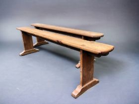 A PAIR OF FRENCH FARMHOUSE FRUITWOOD BENCHES. Length - 180cm Height - 45.5cm