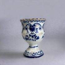 A BLUE & WHITE PAINTED DUTCH DELFT EGG CUP. 18th-Century. moulded form, with painted stylised
