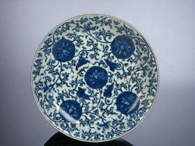A large Chinese porcelain blue & white charger. Qing dynasty, Kangxi period. Painted Lotus