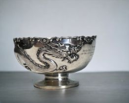 A CHINESE SILVER DRAGON BOWL. Early 20th Century. By Sing Fat, Shanghai. Embossed with a finely