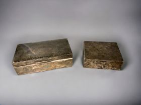 Two sterling silver cigarette boxes. The smaller by Garrard & co (formerly Asprey & Garrard). Lodon,
