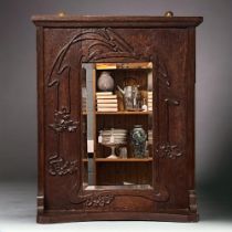 Art Nouveau carved oak wall mirror. Bevel edged mirror and carved foliate design wall shelf.