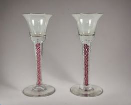 Two Ruby & white Air twist wine glasses. Hand blown Height -15.5cm