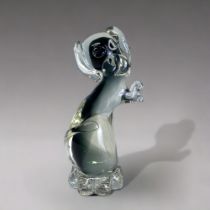 A VINTAGE MURANO GLASS DOG FIGURE. By Campanella, in smoky grey. Sat on his haunches in a begging