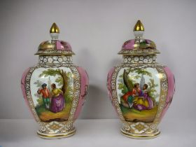 A PAIR OF DRESDEN PORCELAIN LIDDED VASES. Circa 1900. Baluster form, hand painted with romantic