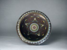 A CHINESE CLOISONNE BOWL. Early 20th century. Intricately decorated with stylised foliate designs,