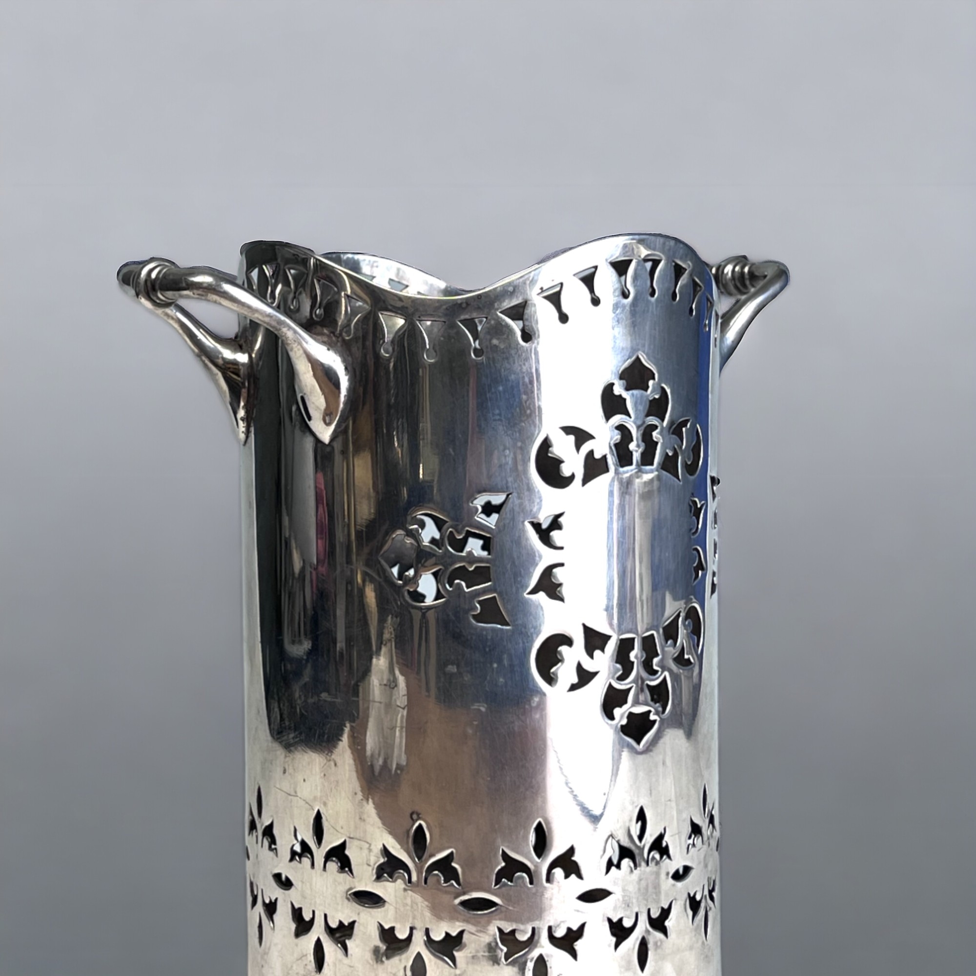 A VICTORIAN SILVER PLATE WINE BOTTLE HOLDER. Reticulated stylised design. Marked to base. Height - - Image 2 of 4