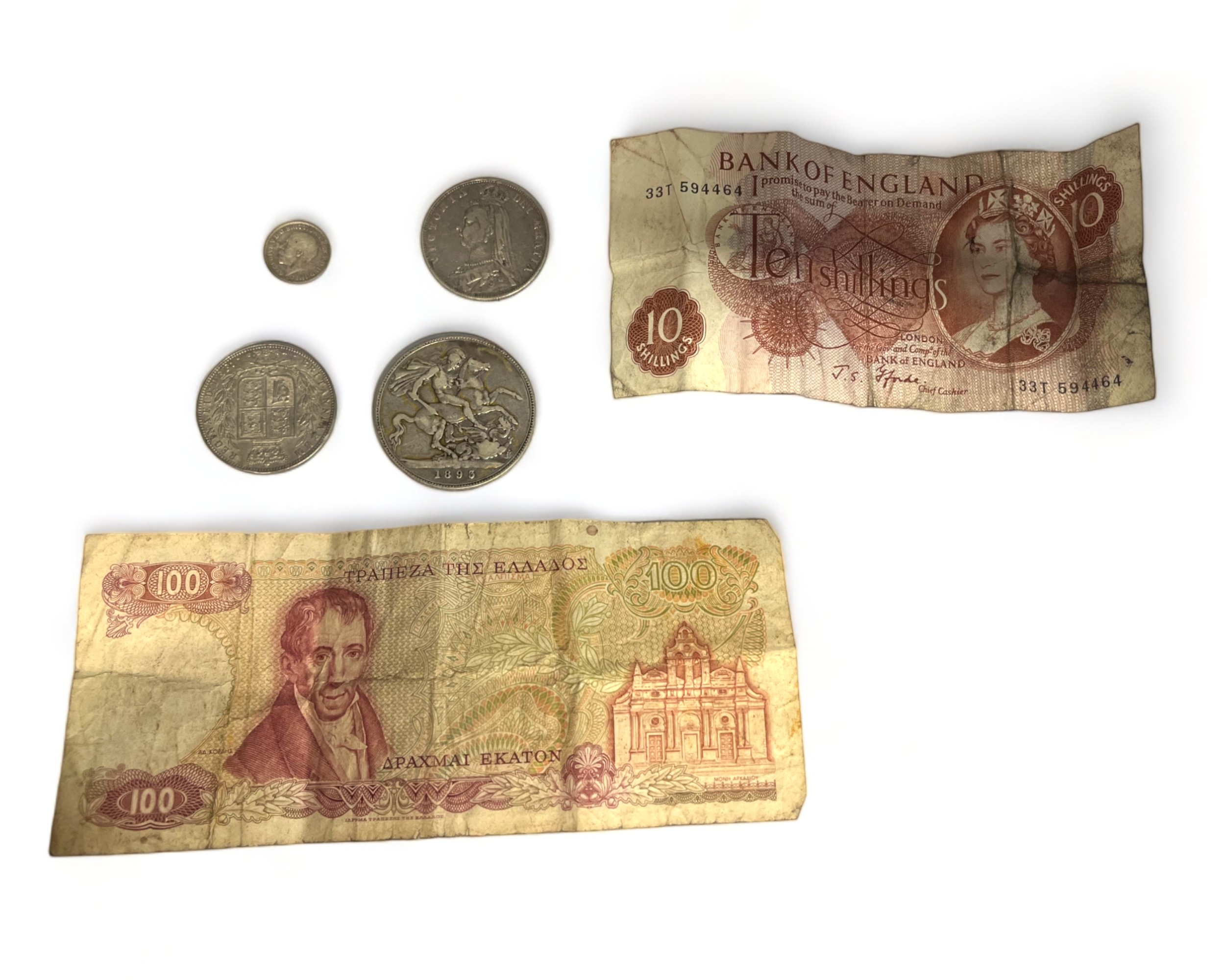 A collection of Coins & notes. Including a ten shilling note, Greek 100 Drachma, 1893 Victoria