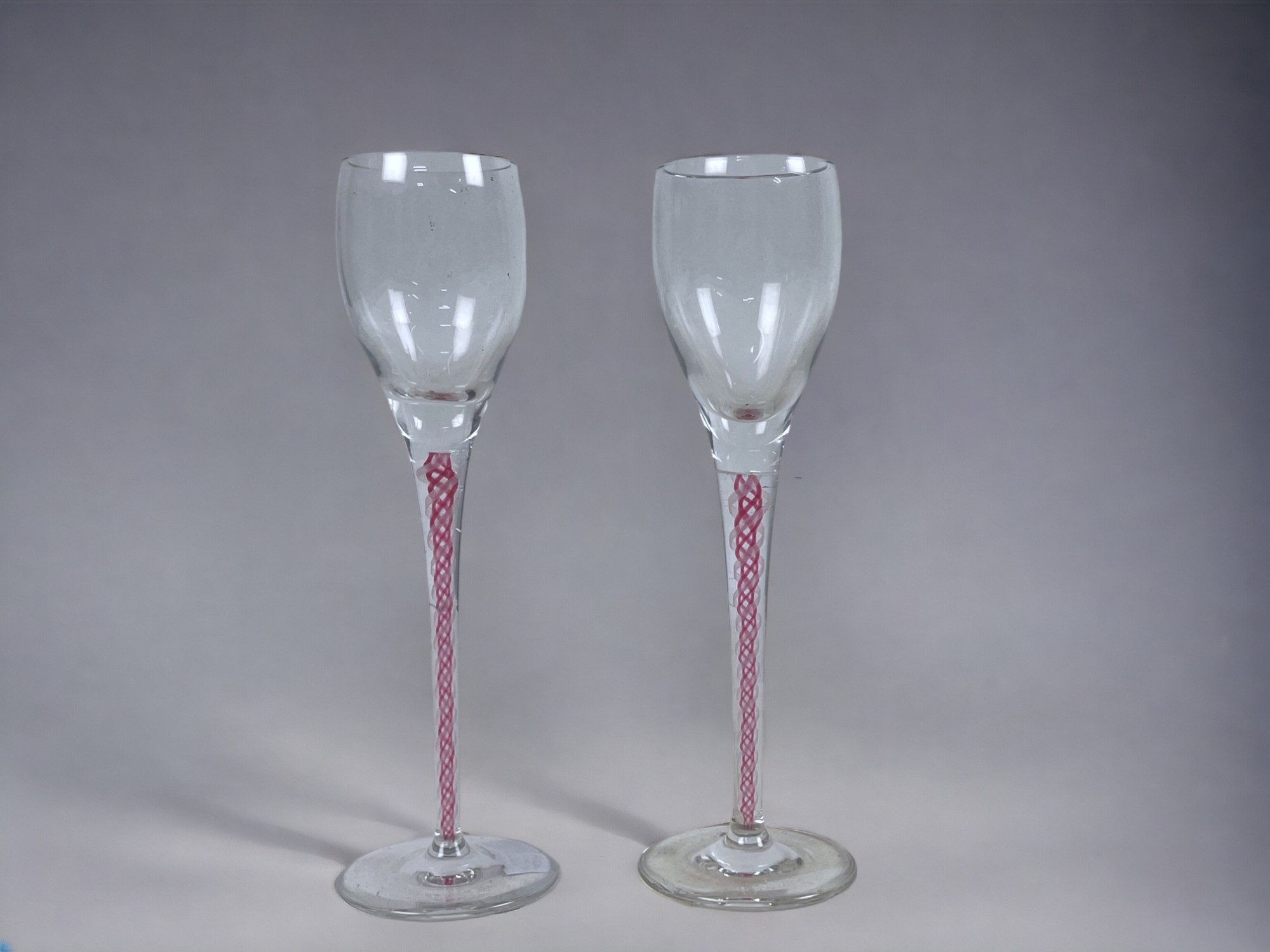 A pair of Ruby Air twist Aperitif / cordial glasses. Height - 15cm