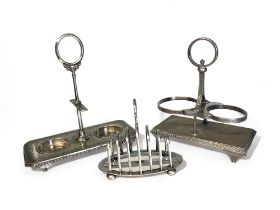 A collection of Christopher Dresser type condiment stands and toast rack. Including Roberts &