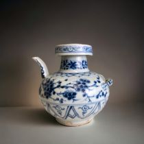 A CHINESE PORCELAIN EWER. Yuan dynasty. Stylised with twin spout & a lobster handle in high
