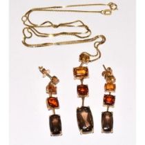 An elegant 9ct gold pendant necklace of semi precious stones in pleasing autumnal colours together