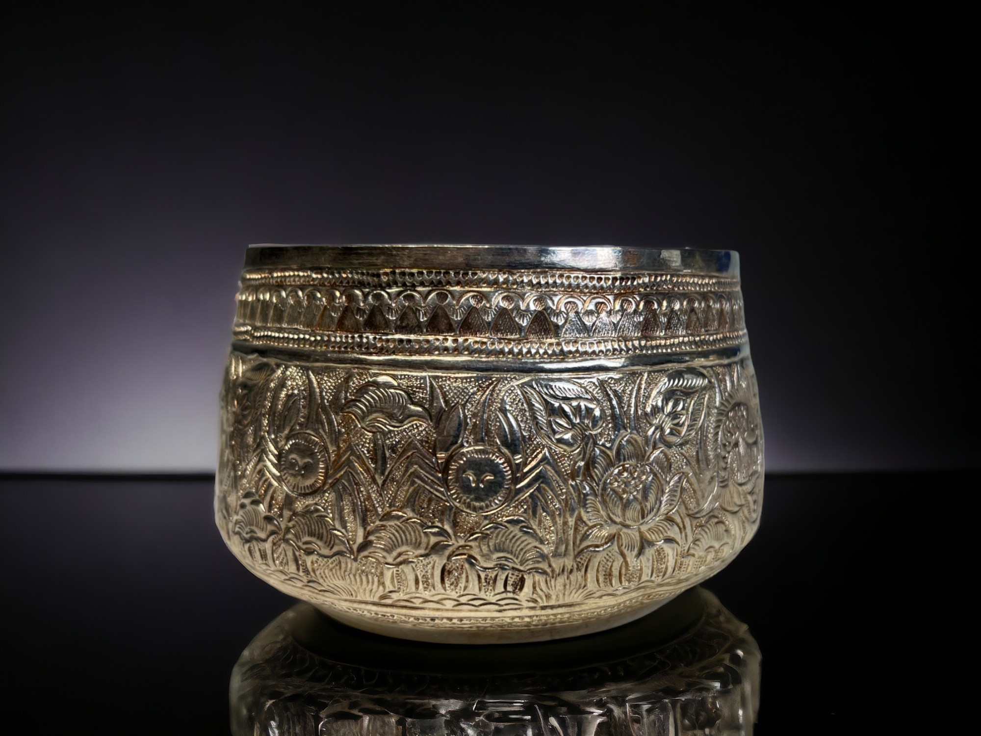 A PAIR OF BURMESE SILVER THABEIK BOWL. Repousse decorated with fish and crabs amongst stylised - Image 3 of 3