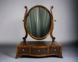 A George III Mahogany & Kingwood crossbanded toilet mirror. Serpentine base, fitted with three