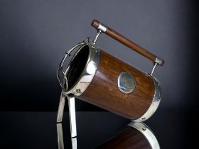 A RARE CHRISTOPHER DRESSER FOR HUKIN & HEATH BOTTLE-HOLDER. Wood and silver plate design, with