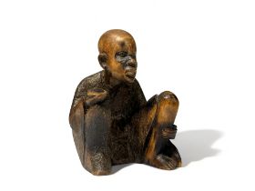 TRIBAL AFRICAN CARVED WOOD FIGURE. Depicting a man begging. Signed 'By Simon' to base. Height - 9cm