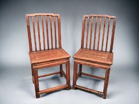 A PAIR OF CHINESE CARVED PROVINCIAL CHAIRS. Late Qing dynasty. Probably Northern Provinces.