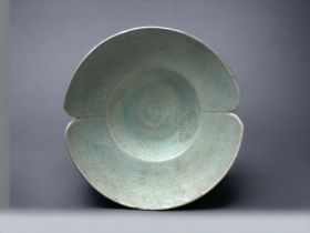 A STUDIO POTTERY 'LOTUS' SHAPE BOWL. With a longquan type celadon glaze. Impressed mark to base. 6 x