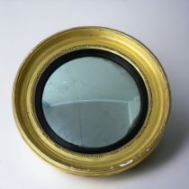A George III round Gilt frame wall mirror. English, 19th Century.