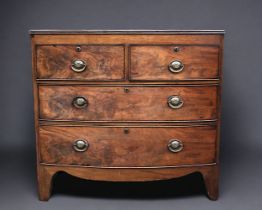 An Early 19th Century 2 over 2 Mahogany Chest of drawers. Shaped swept apron with bracket feet.