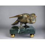 A BRASS FIGURAL OWL DESK STAND. French, 19th/20th century. Perched on green marble base, with four