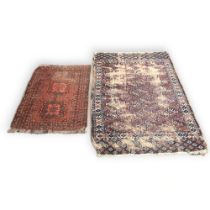 Antique Afghan prayer rug, red ground 37" x 28.5" together with a larger Antique rug 56" x 40.5".