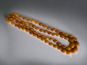 Baltic 'Butterscotch' Amber double row necklace. Graduating beads, with gilt metal clasp.