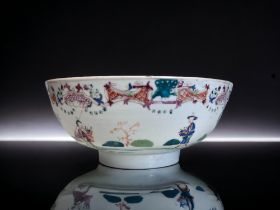 A CHINESE PORCELAIN PUNCH BOWL. Qianglong (1736-95). Overglaze enamel painted figures amongst