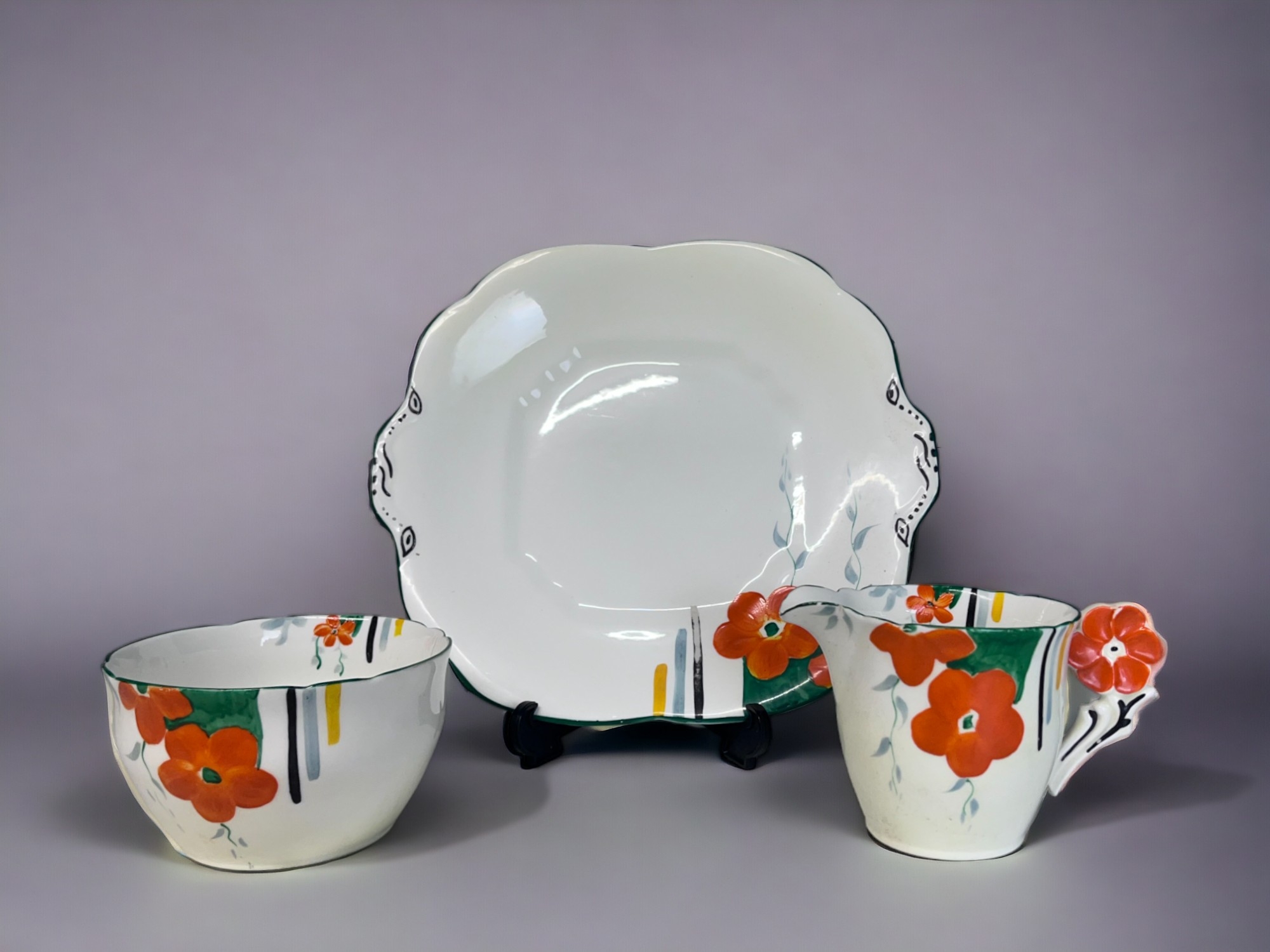 AN ART DECO HAND PAINTED PART TEASET. Hand painted floral pattern with 'flower' handles. Includes, - Image 2 of 4