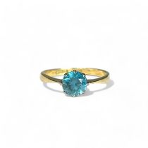 A 10ct white & yellow Gold ladies solitaire ring. Set with a solitaire blue stone.  Size 0 1/2 