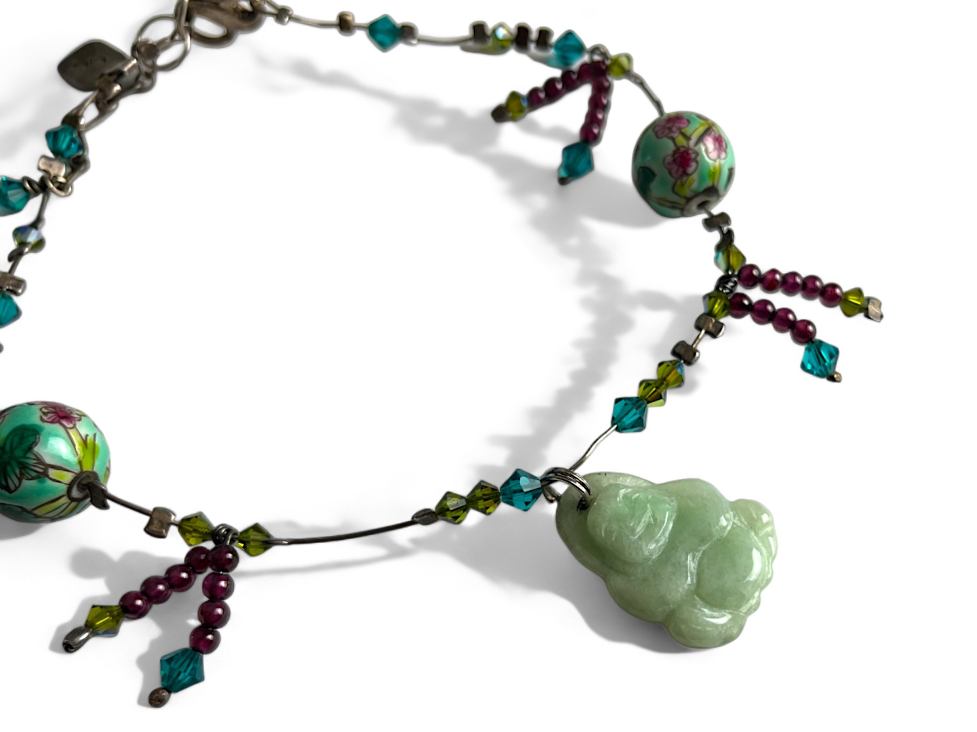 A Chinese Charm anklet. Mounted with Jade Buddha, flower painted balls and glass beads.  - Image 2 of 2