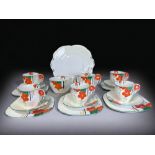 An Art Deco Hand Painted Part Teaset. Hand painted floral pattern with 'flower' handles. Includes, f