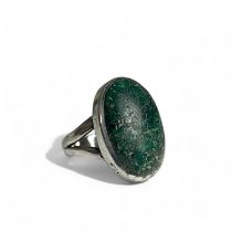A sterling silver & unpolished cabochon stone ring. Possibly Maw sit sit?