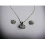 A 9ct Gold & Diamond cluster pendant necklace and earrings set. Hallmarked to bail. 
