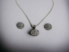 A 9ct Gold & Diamond cluster pendant necklace and earrings set. Hallmarked to bail.