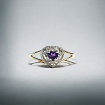 A 9ct Gold & Amethyst 'heart' shape ring. Set with one small accent Diamond. Size M