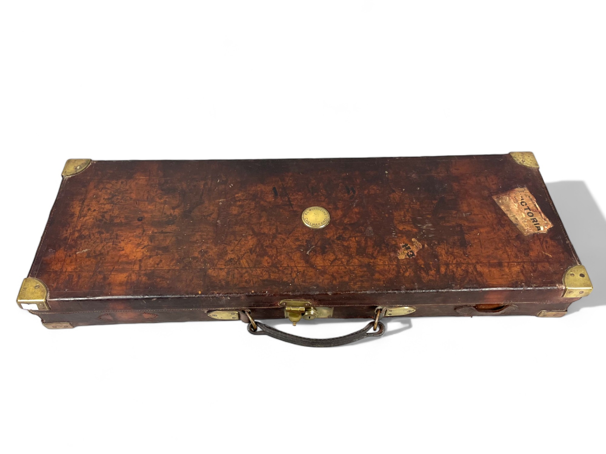 Antique Holland & Holland leather Gun case. Fitted interior and original labels. 84 x 29 x 9cm