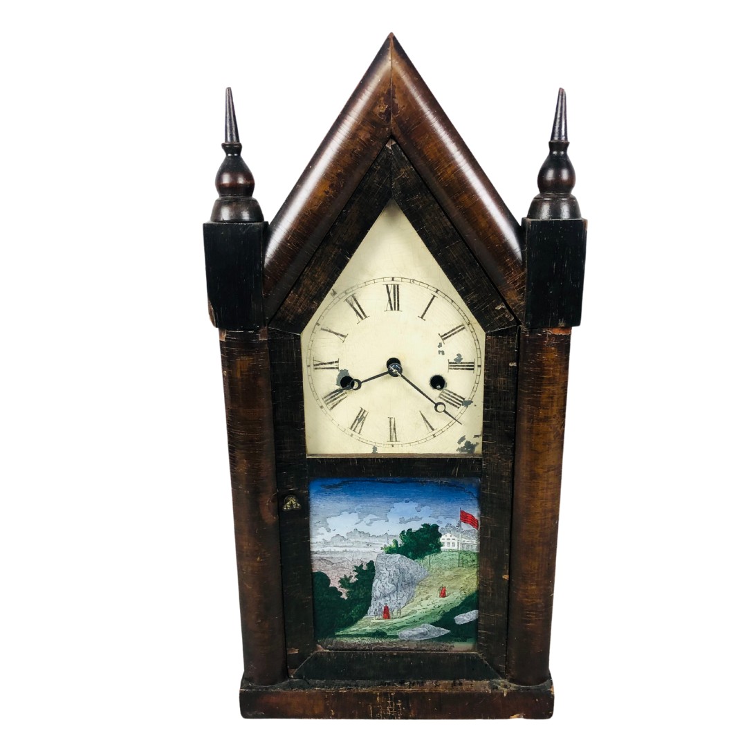 19th Century American Mantle Clock in the Gothic manner.  Has Key and Pendulum and has been seen wor
