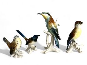 A collection of four Karl Ens porcelain bird figures.
