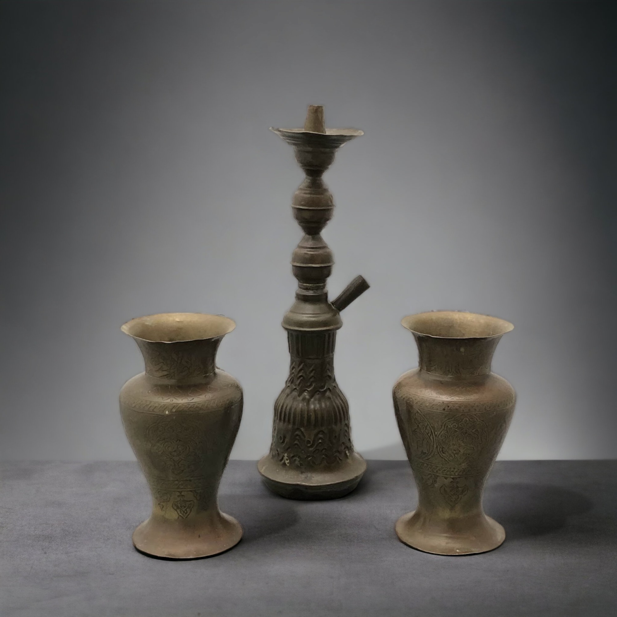 A 19th Century Middle Eastern Shisha Pipe Base, together with Two Islamic Vases, Decorated with Kufi