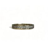 A 9ct Gold and Diamonds half eternity ring. Fully hallmarked. Size - K 1/2 Approx. 2.2g 