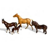 A Collection of Four Bone China Horse Figures. 