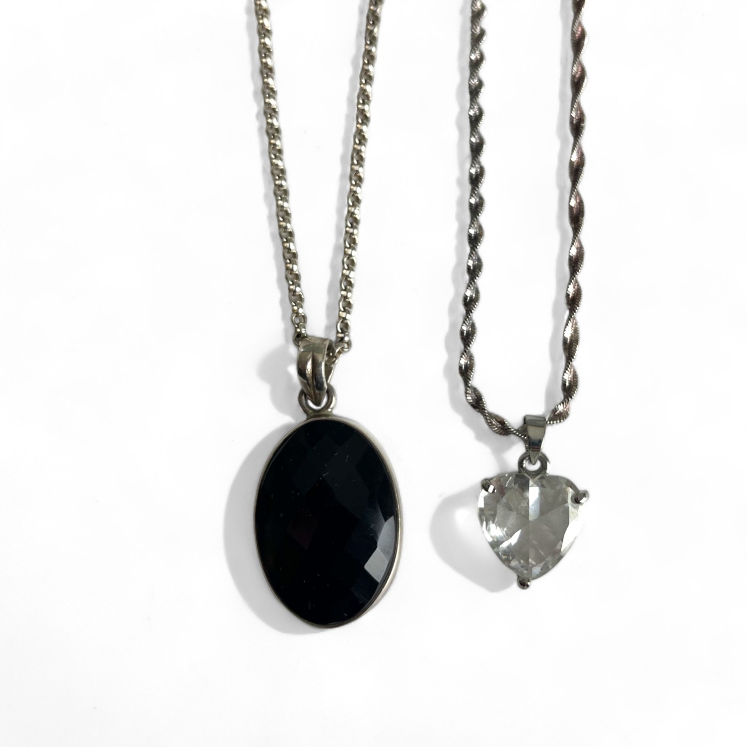A silver and facet cut black onyx cabochon pendant necklace. together with a gold plated heart shape - Image 2 of 2