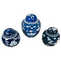 Lidded Ginger Jars.  Prunus decorations. 