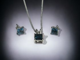 A Silver & blue Topaz pendant necklace and earrings set. Total of 5.14cts. 