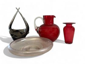 A collection of glass. Including cranberry jug & vase. Iridescent glass bowl and scandinavian centre